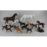 A Beswick model of a horse in brown gloss 21.5cm high, a Beswick model horse and foal in matt white,