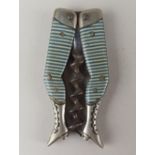 A German ladies legs novelty pocket corkscrew blue and white striped stockings and bladed worm,