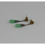 A pair of gold and jade pendant earrings each having a character surmount, the butterflies