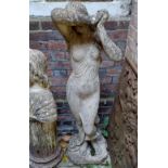 A composite garden statue of a female nude with raised arms 118cm high