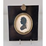 John Field (1772-1848), an oval bronzed silhouette profile portrait of a lady to the left,