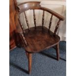 A 'Captains' elbow chair with turned supports, on splayed tapered legs