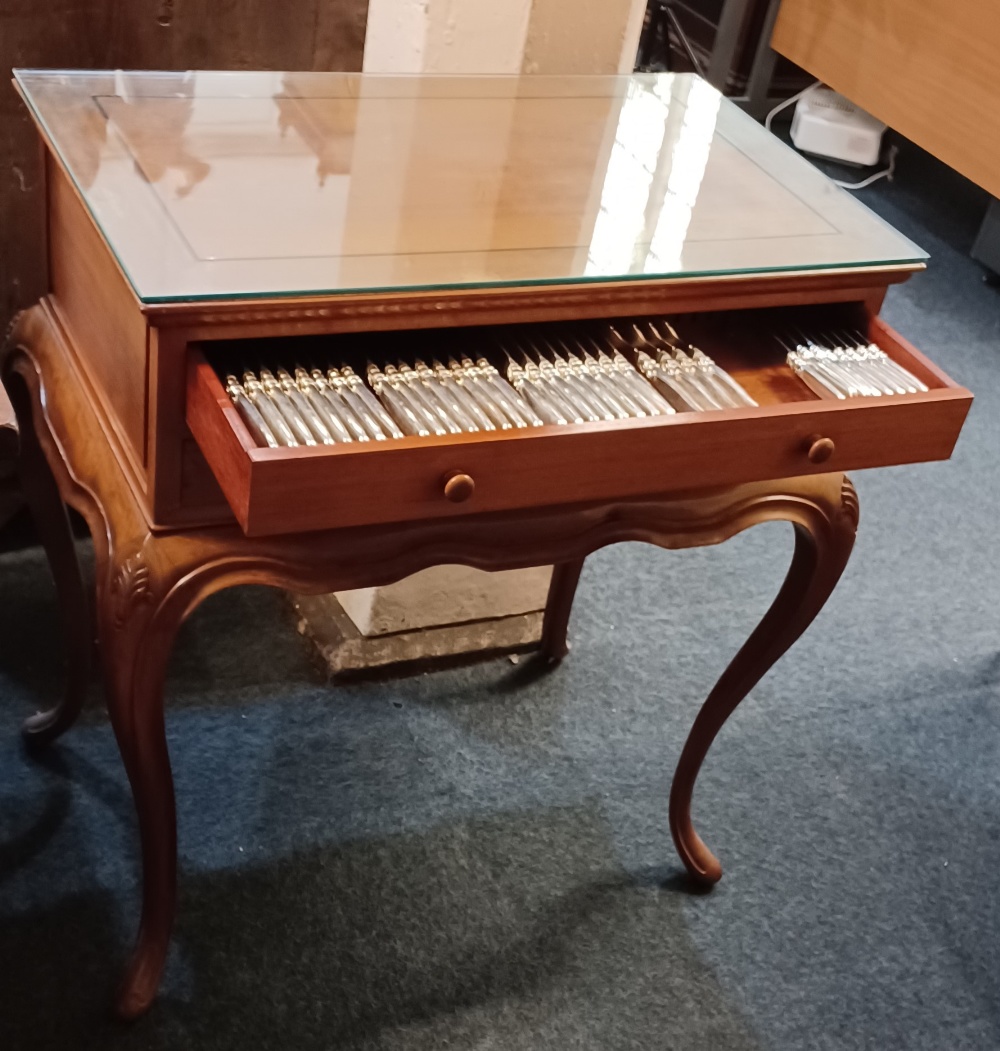 A Chinese canteen table of silver plated cutlery two fitted drawers with a service for a setting