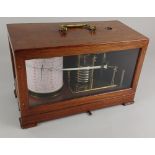 A mahogany and glass cased brass barograph 31cm