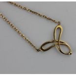 An openwork pendant on an integral chain, length 44cm