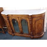 A Victorian marble topped walnut credenza two central arch glazed doors flanked by turned column