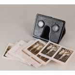 A Spirella Company metal stereoscopic card viewer with a collection of cards including models