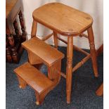 An oak metamorphic folding stool / steps, on turned legs width 38cm, height 54cm