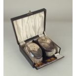 A pair of Queen Elizabeth II silver backed hairbrushes and a comb (a/f), with engraved initials,