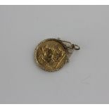 A George V gold sovereign dated 1913 in 9ct gold loose pendant mount