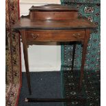 An Edwardian inlaid mahogany writing table with stationary box, leather inset top, single bowfronted