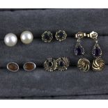 Four pairs of 9ct gold earrings, to include one pair set with dark sapphires, and two pairs set with