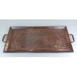 A St Albans School of Art copper two-handled tray of rectangular form, with border of sinuous Art