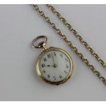 A Swiss 15ct gold and enamel open face fob watch, with 9ct gold bow, the white enamel dial with