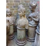 Four composite garden ornaments in the form of three busts of women and a young boy, each on