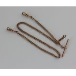 A 9ct rose gold watch chain with two clasps and T bar, 16g