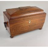 A 19th century rosewood tea caddy of sarcophagus form with ring handles and bone escutcheon, on