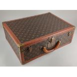 A Louis Vuitton suitcase, Serial No 923594, with brass lock 156460, 37cm by 50cm by 17cm, no key (