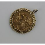 An Edward VII gold sovereign dated 1902 in loose 9ct gold pendant mount