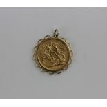 A Queen Victoria gold sovereign dated 1876 in loose 9ct gold pendant mount