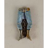 A German novelty ladies legs pocket corkscrew blue and cream striped stockings with bladed worm,