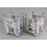 A pair of Continental porcelain planters, of square form, decorated with birds amongst foliage on