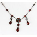 An Arts & Crafts silver necklace, set with moonstones and carnelians, length of central drop