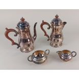 A pair of silver plated coffee pots, together with a plated milk jug and sugar bowl