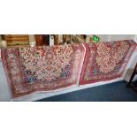 A pair of Eastern hand-knotted rugs, possibly Iranian, both signed, pink ground with floral decorat