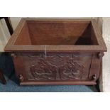 A carved oak rectangular planter with metal liner, on castors width 69cm, height 45cm