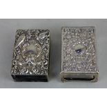 A Victorian silver matchbox cover with embossed scroll top on ball feet, maker James Deakin &