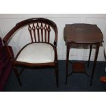 An Edwardian inlaid mahogany open tub chair with pierced supports and a mahogany occasional table