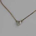 A diamond pendant necklace, claw set with a heart-cut brilliant diamond on an integral link chain