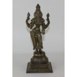 A bronze figure of Indian Hindu deity Shiva standing on circular plinth and square base 32cm