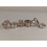 Three silver serviette rings and three foreign siver napkin rings (a/f) wt.3oz