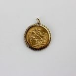 A George V gold sovereign dated 1915 in 9ct gold loose fitting pendant mount