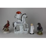 A Staffordshire Zebra spill vase 28cm a Kowa porcelain Stock Dove, 15cm another model of a bird