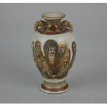 A small Japanese Satsuma ware baluster vase decorated with figures and gilt embellishments 12.5cm