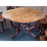 A Victorian walnut drop leaf table, the lobed top with moulded edge and two drop flaps, on four