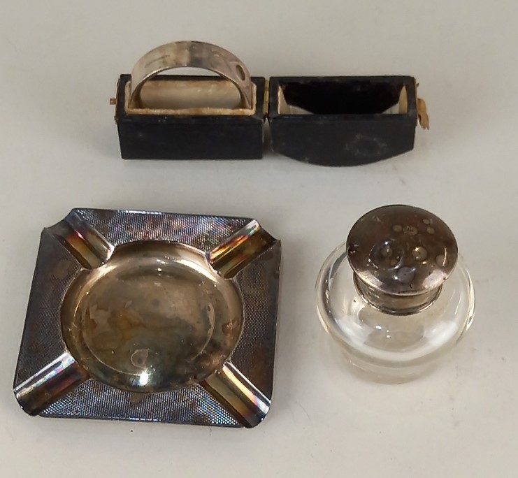 A modern silver ashtray Birmingham 1966, silver topped dressing table bottle and a cased sterling