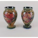 A pair of William Moorcroft for Moorcroft pottery 'Spanish' pattern vases, of baluster form,