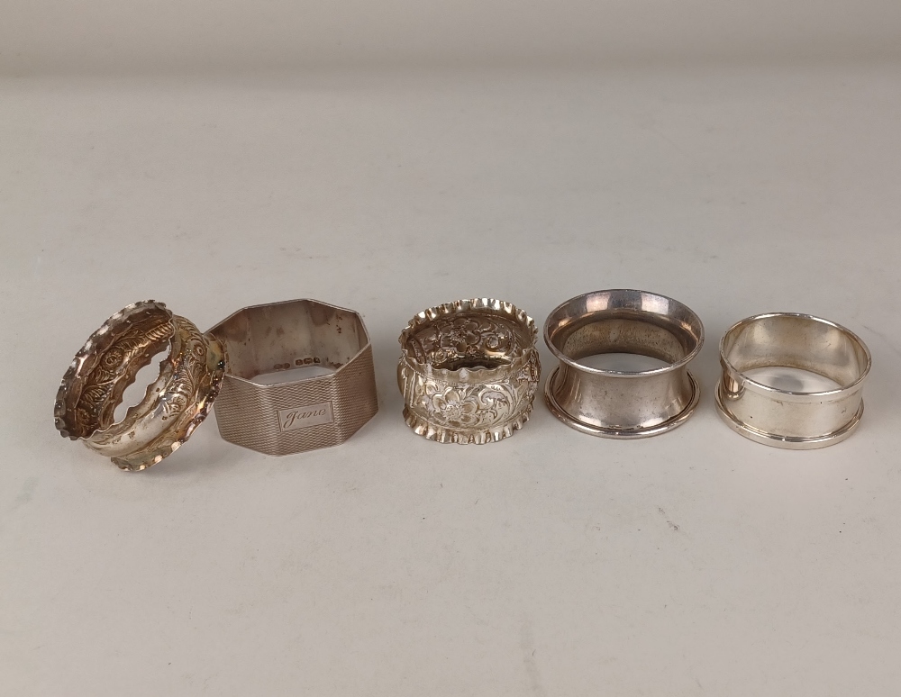 Five various silver serviette rings, one insribed 'Jane', 2.1oz