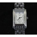 A lady's Longines stainless steel diamond set bracelet watch, the rectangular case with a row of