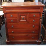 A reproduction mahogany chest with frieze drawer. an arrangement of five narrow drawers above