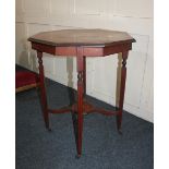 A Victorian inlaid mahogany octagonal occasional table on square tapered legs and castors with