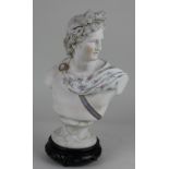 A painted Parian ware bust of Apollo 29cm high, on associated wooden stand