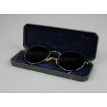 A pair of Second World War Mark VIII sunglasses impressed BAO to bridge, the case marked 'STORES REF