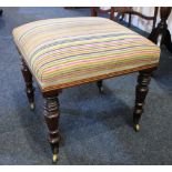 A rosewood rectangular striped upholstered footstool on four baluster legs and castors, 40cm