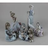 Five various Lladro porcelain figures to include a girl on the telephone and a seated boy with hound