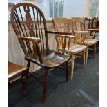 A Windsor armchair with pierced wheel back splat and a pair of light wood slatted back farmhouse